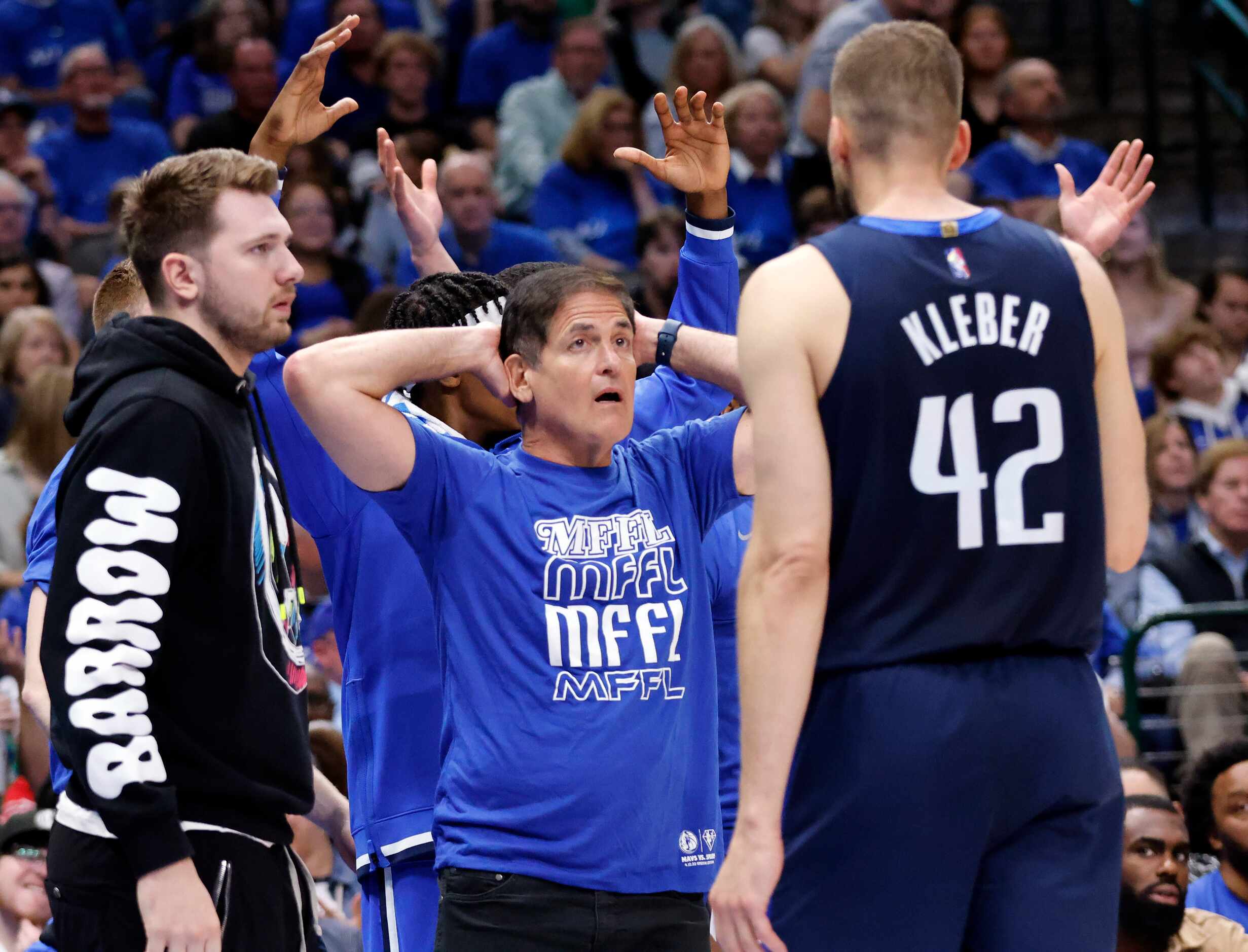 Dallas Mavericks owner Mark Cuban reacts to a called foul on his team during the first half...