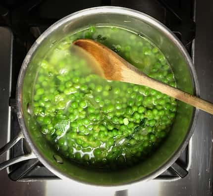 Simmer frozen peas with fresh mint, wilted lettuce and water to make a dreamy soup. (Leslie...