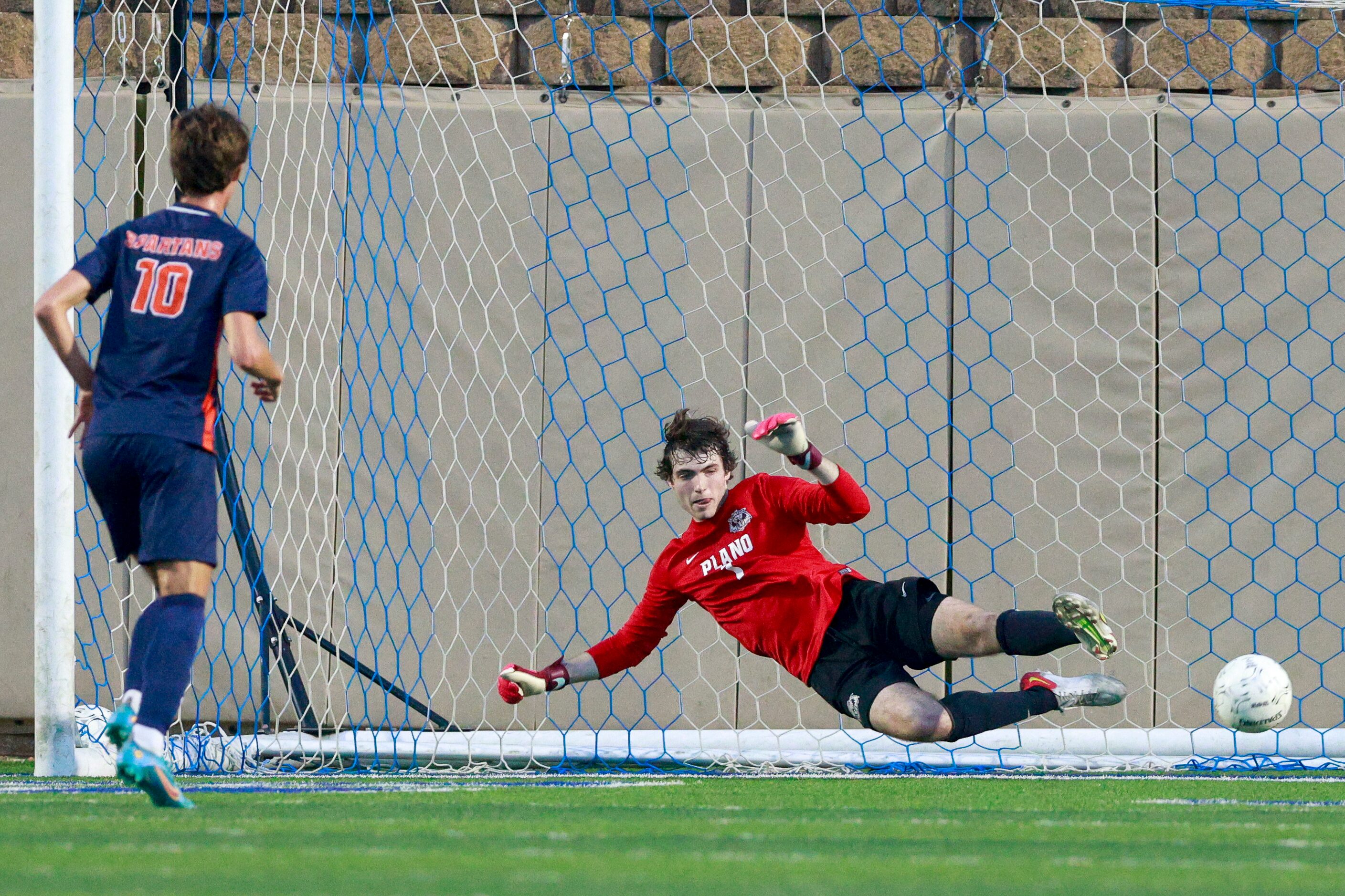 Katy Seven Lakes midfielder Aidan Morrison (10) scores on a penalty kick past Plano...