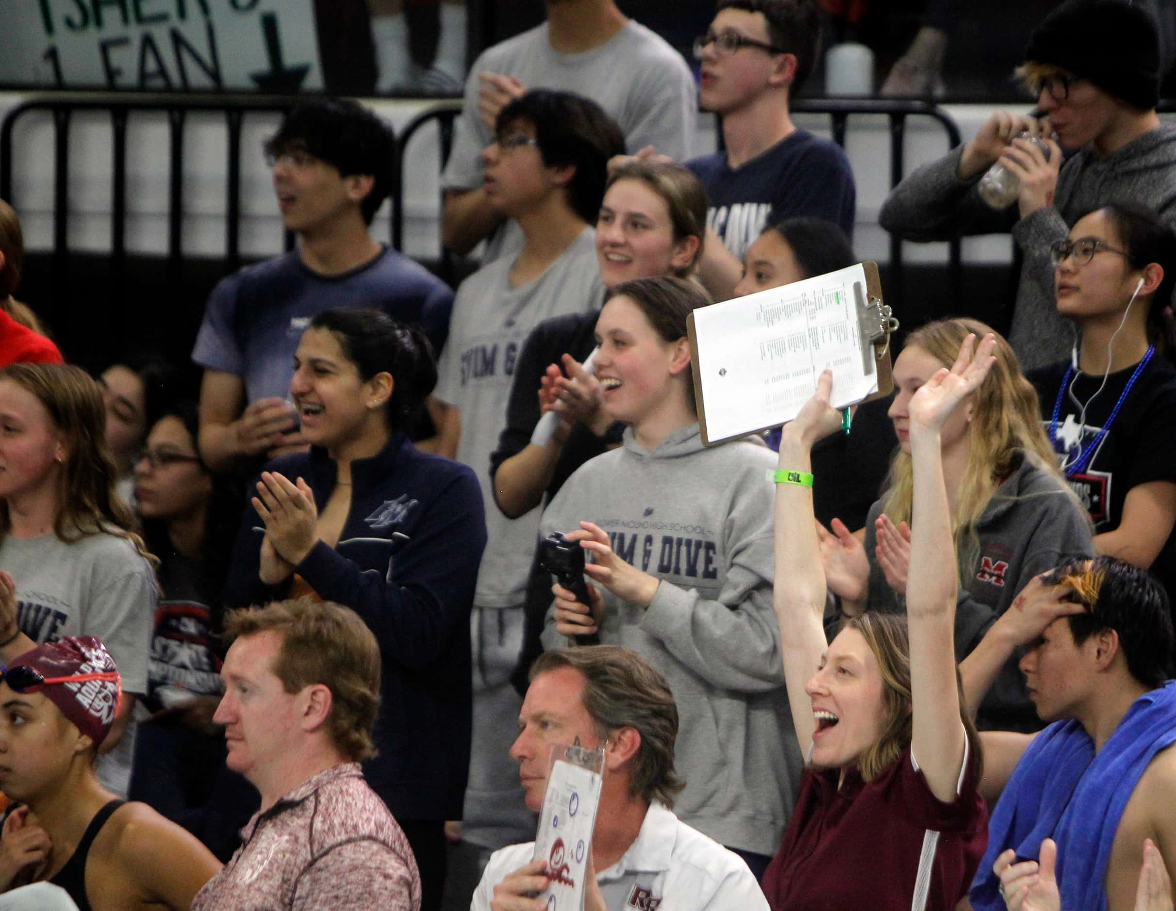 Fans react to Flower Mound Marcus swimmer Julia Wozniak's first place finish in the 6A Girls...