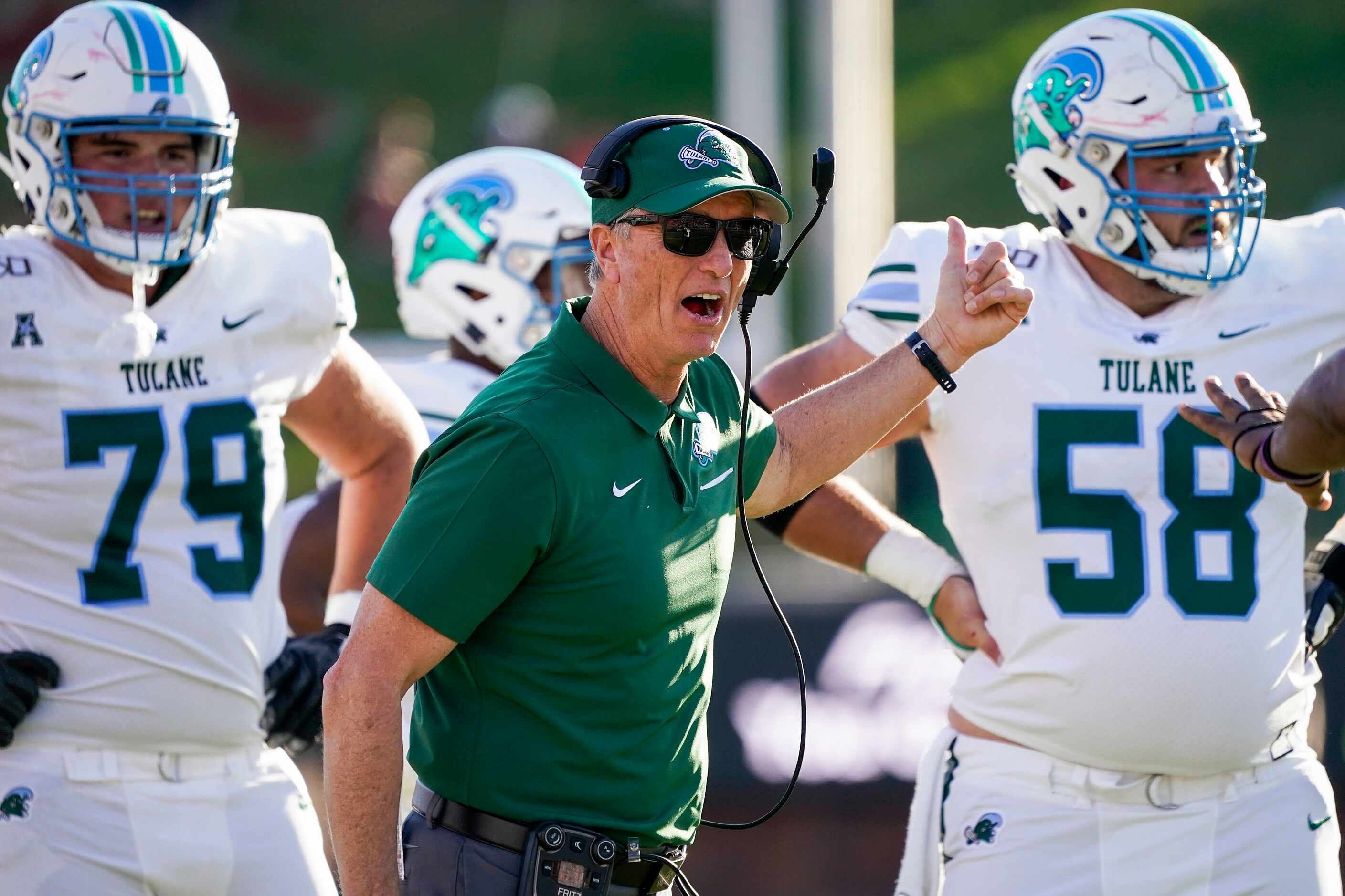Tulane head coach Willie Fritz yells toward an official during the first half of an NCAA...