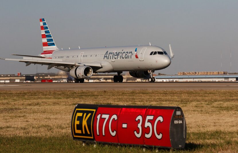 An American Airlines Airbus A321 lands on Runway 17C at DFW International Airport on Monday....