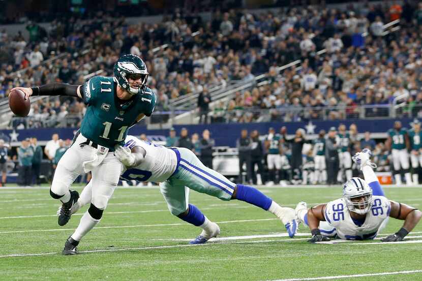 Philadelphia Eagles quarterback Carson Wentz (11) breaks away from Dallas Cowboys defensive...