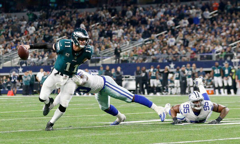 Philadelphia Eagles quarterback Carson Wentz (11) breaks away from Dallas Cowboys defensive...