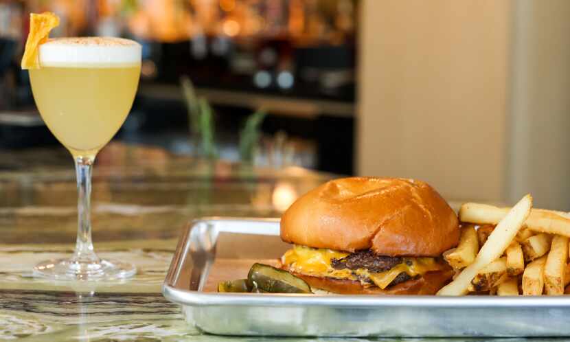 The OG Hide Double Cheeseburger, served at Hide's new bar on Greenville Avenue in Dallas, is...