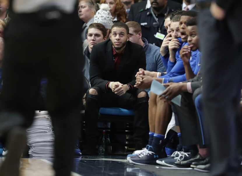 Dallas Mavericks guard Seth Curry watches from the bench during the first half of an NBA...