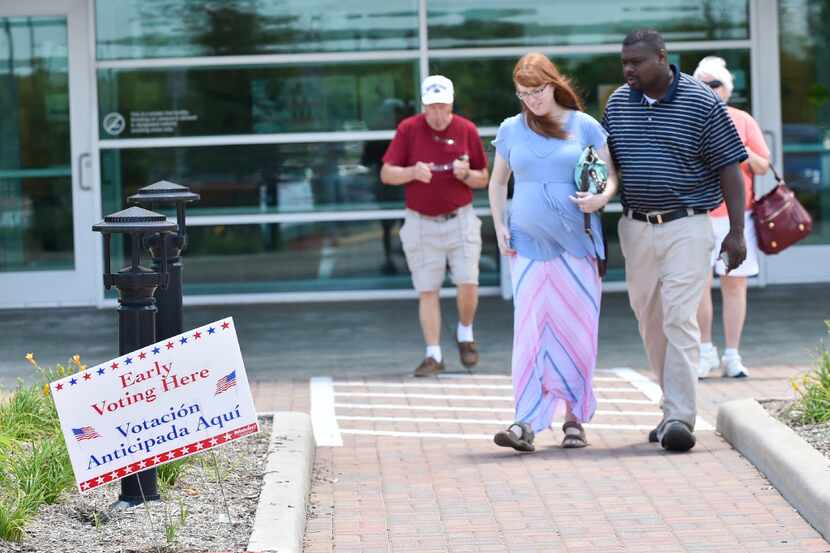 Voters come to place their ballots at the Denton County Elections Administration Building,...