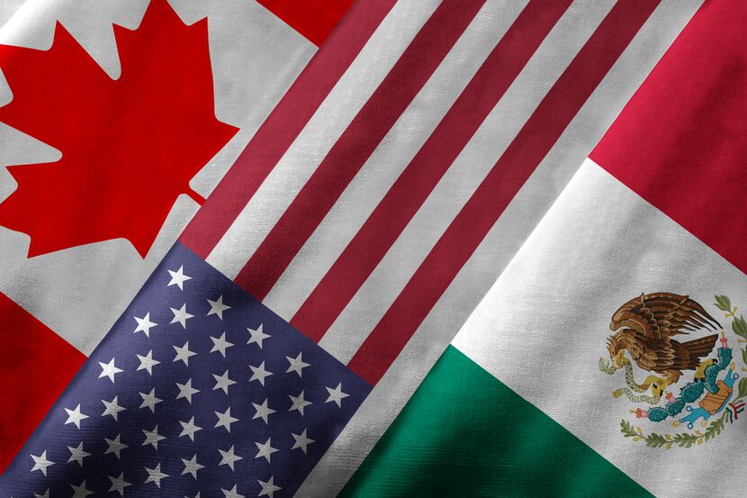 Closeup of the flags of the North American Free Trade Agreement NAFTA members on textile...
