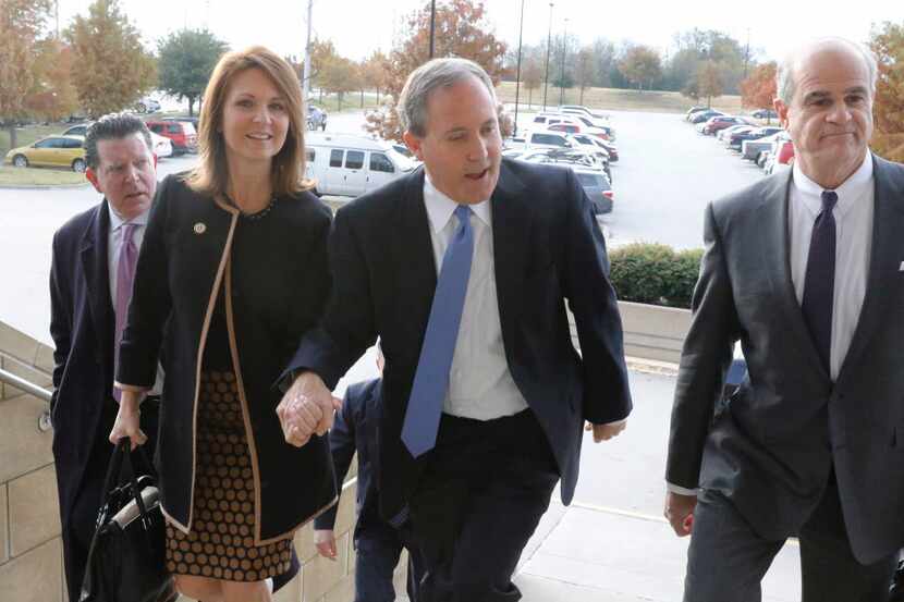  Texas Attorney General Ken Paxton and his wife Angela arrive at the Collin County...