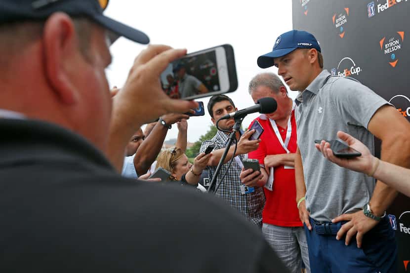 Jordan Spieth talks with the media after he finishes the second round with 5-over par at the...