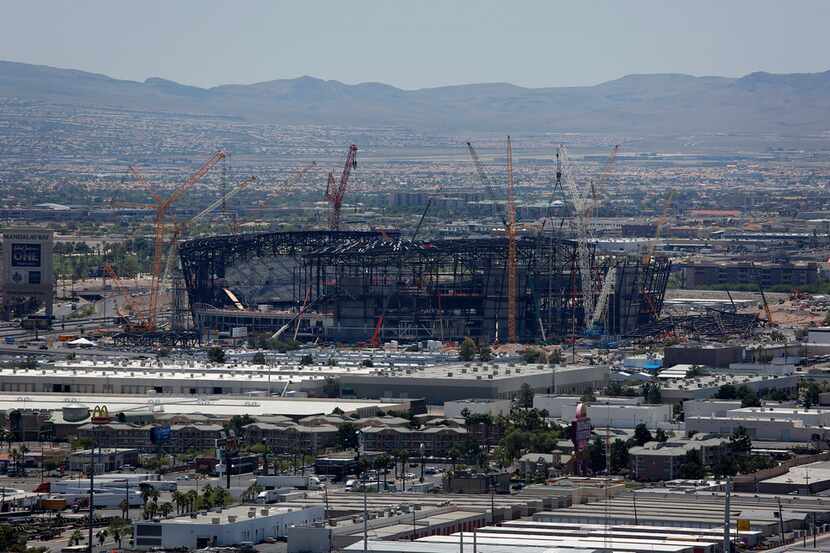 Construction cranes surround the future NFL Raiders football stadium Tuesday, June 4, 2019,...