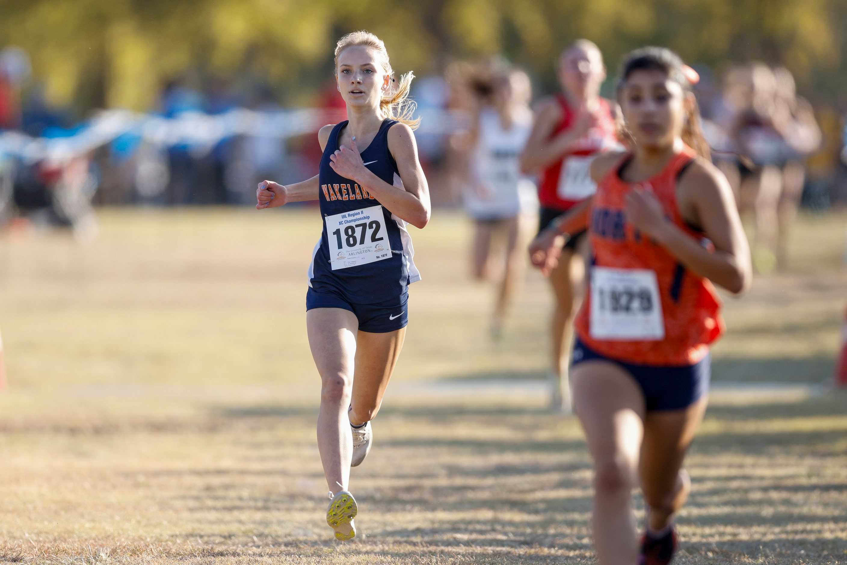 Frisco Wakeland’s Presley Robertson races to the finish line during the UIL Class 5A Region...