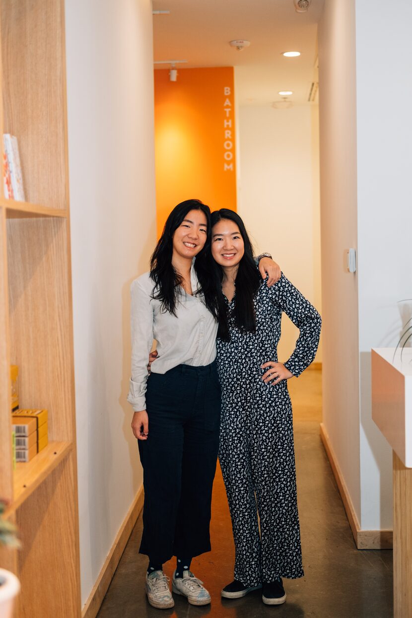 Jahee (left) and Minji Son, co-owners of Teasom, stand inside their shop in West Village,...