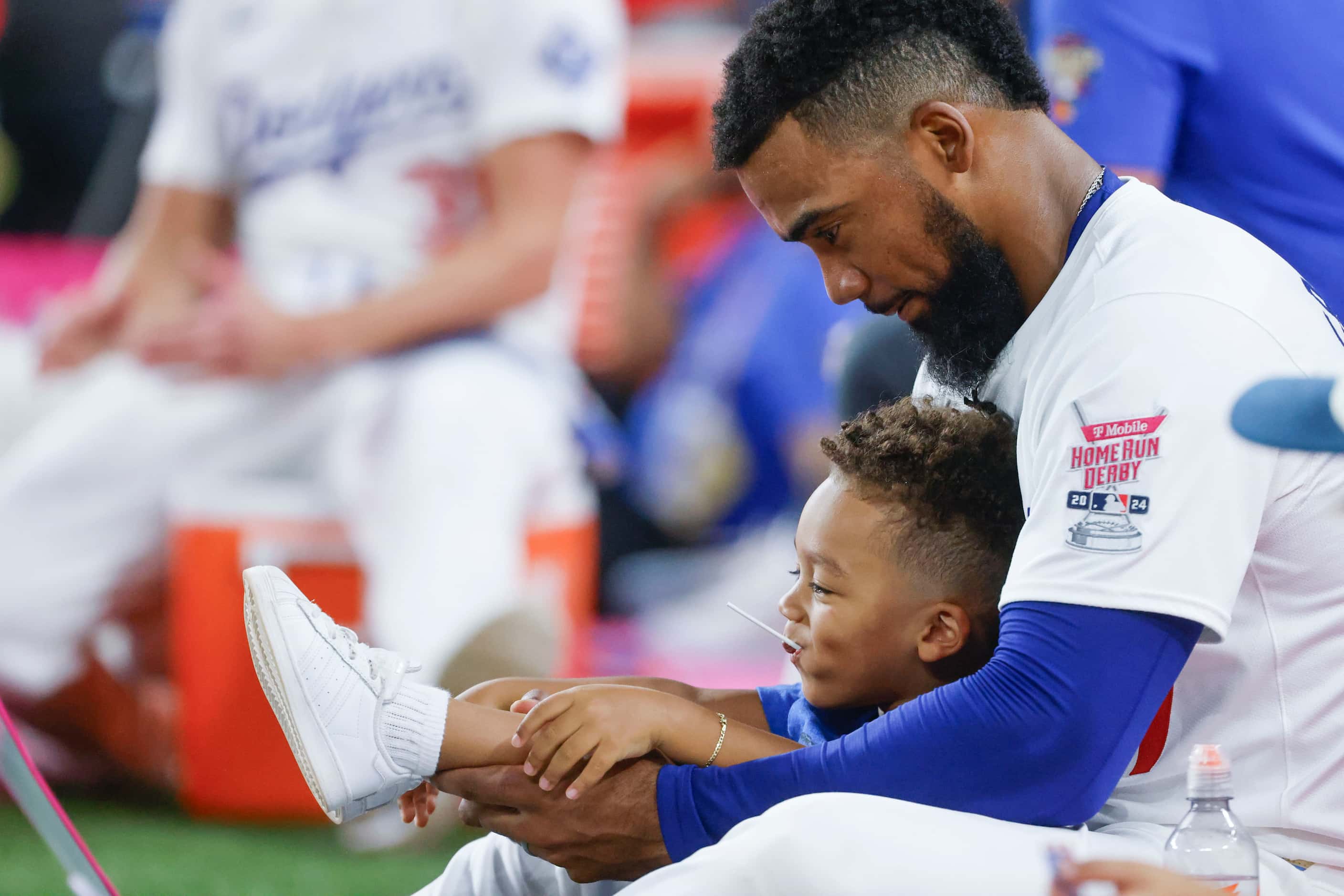 Teoscar Hernandez, of Los Angeles Dodgers sits by the sideline during the semi final of MLB...