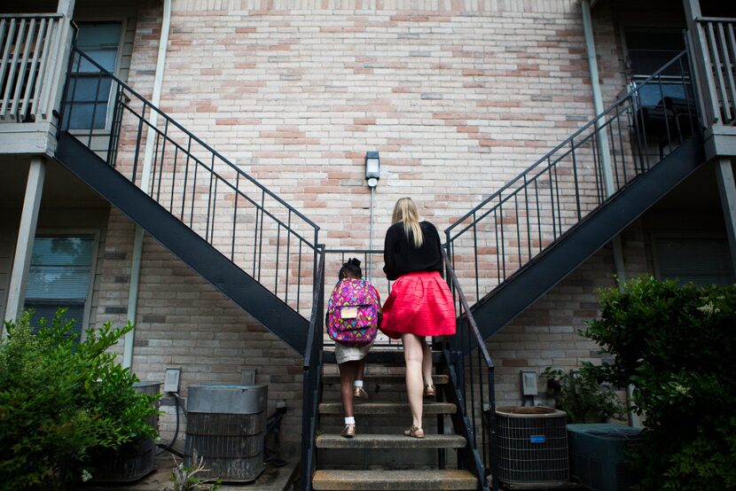 Child Protective Services caseworker Christina McKinney takes one of the children she...