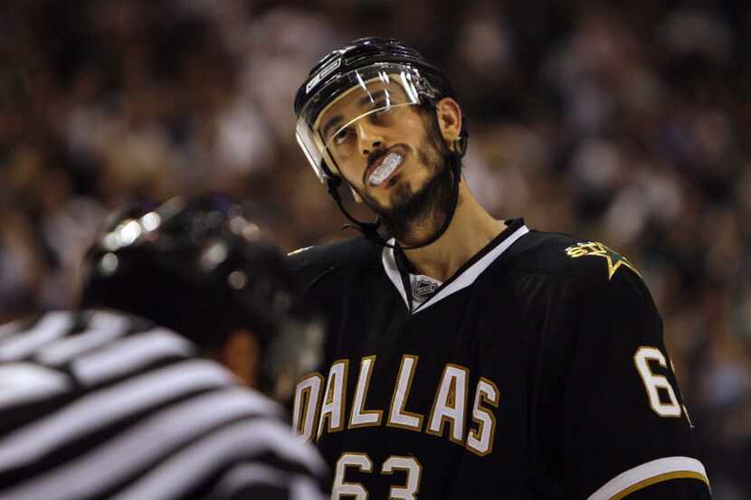 Dallas Stars center Mike Ribeiro stares up at the scoreboard as he prepares for a face off...