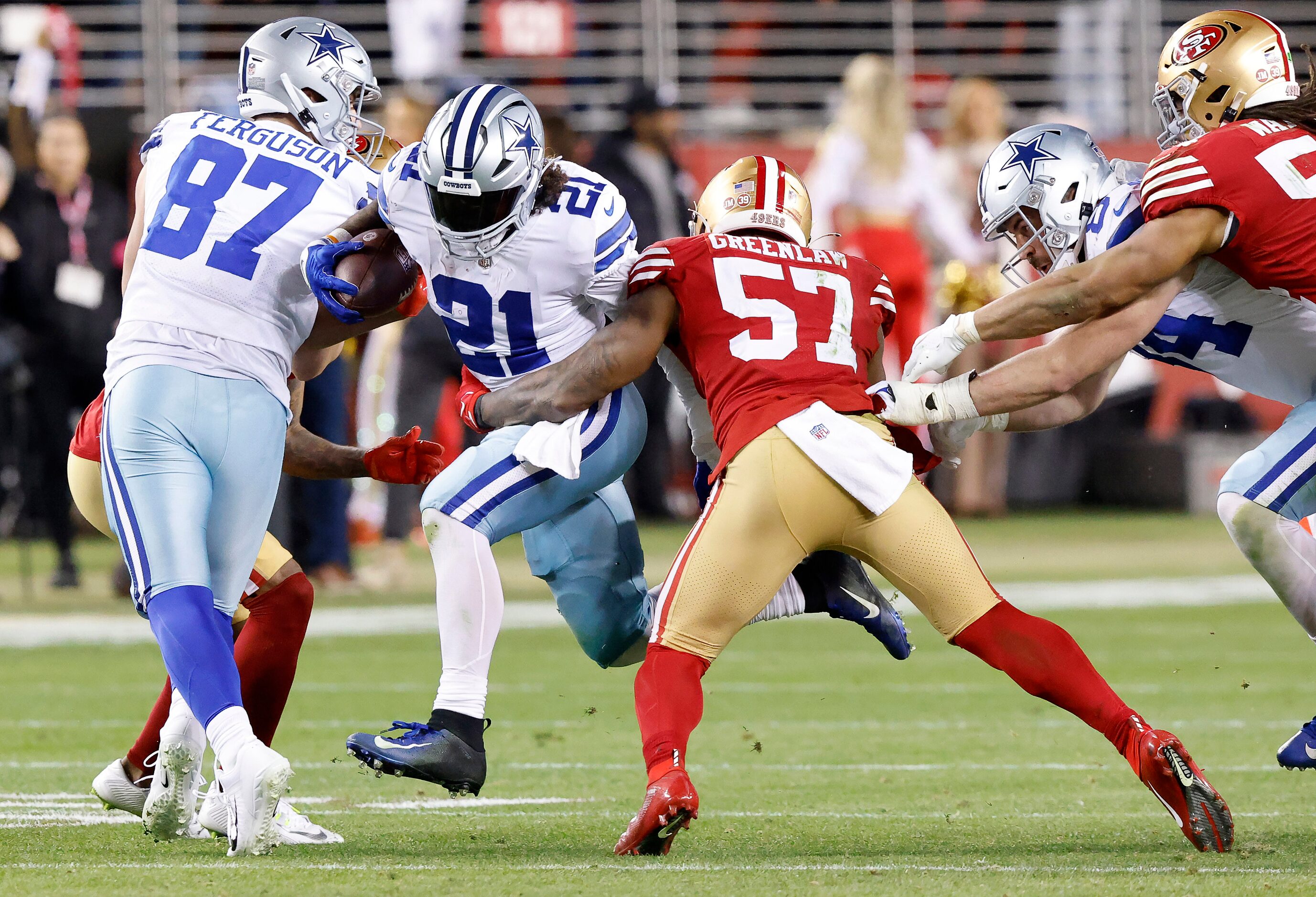 Dallas Cowboys running back Ezekiel Elliott (21) is tackled in the fourth quarter by San...