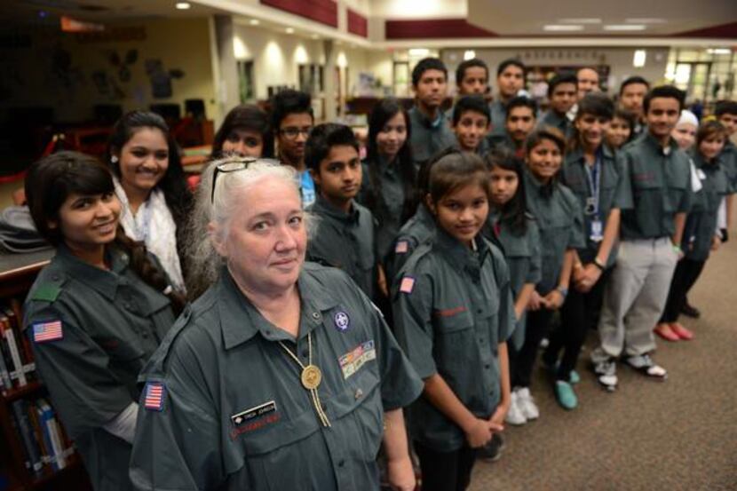 
Tricia Johnson leads a group of more than 40 Conrad High School students who form Venturing...