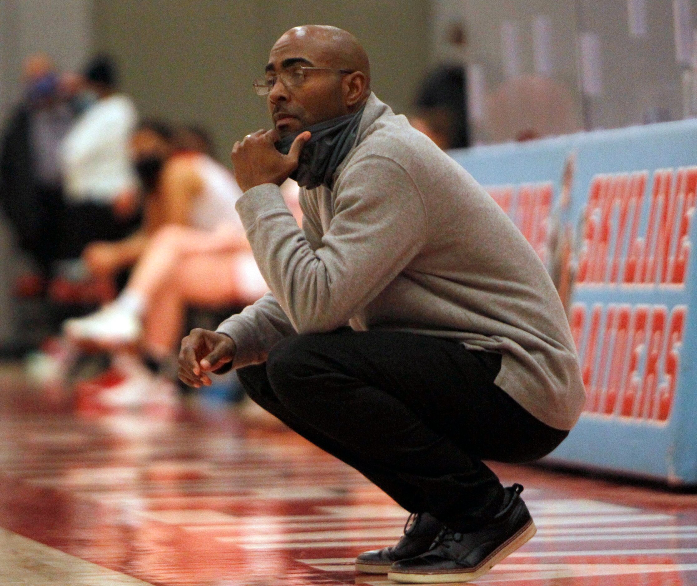 Dallas Spruce head coach Amon Wilson watches first half action against Dallas Woodrow...