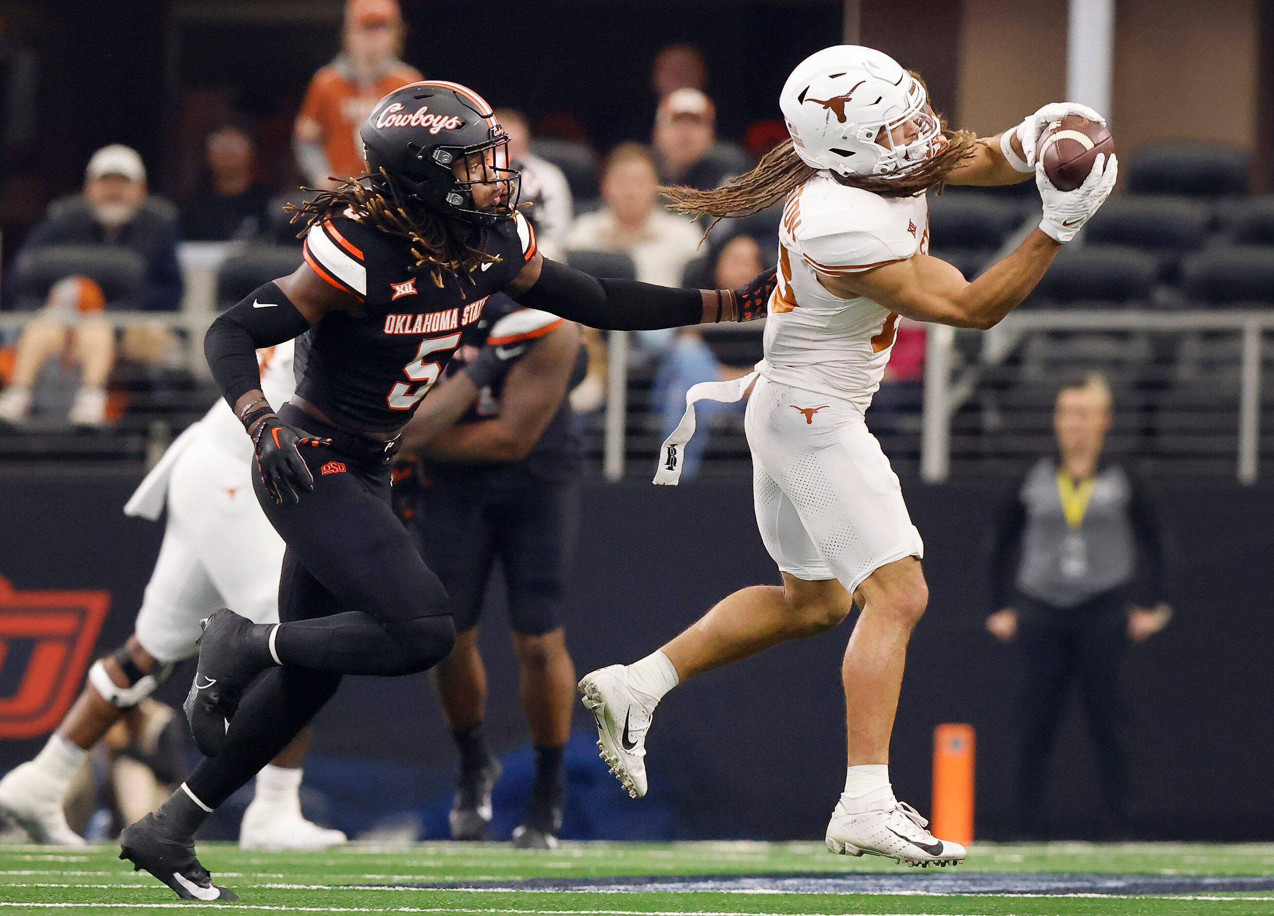 Texas Longhorns wide receiver Jordan Whittington (13)  catches a second quarter pass as he’s...