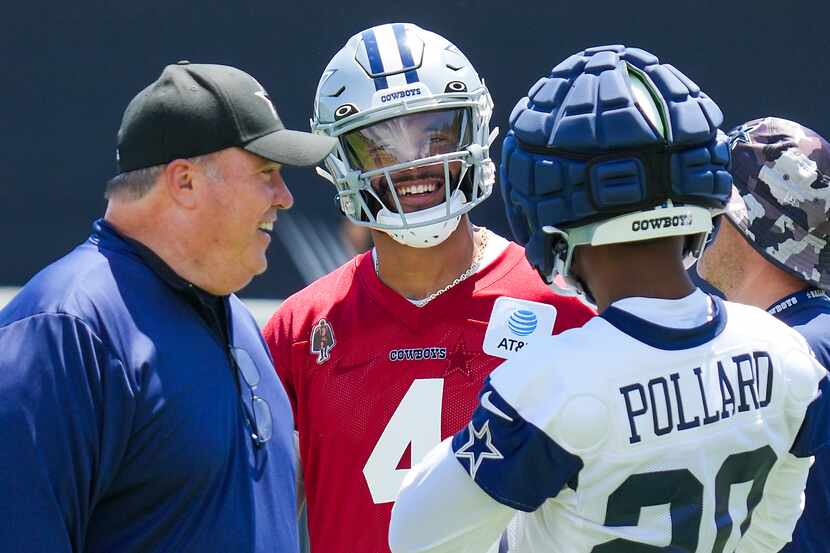 Dallas Cowboys quarterback Dak Prescott (4) laughs with head coach Mike McCarthy and running...