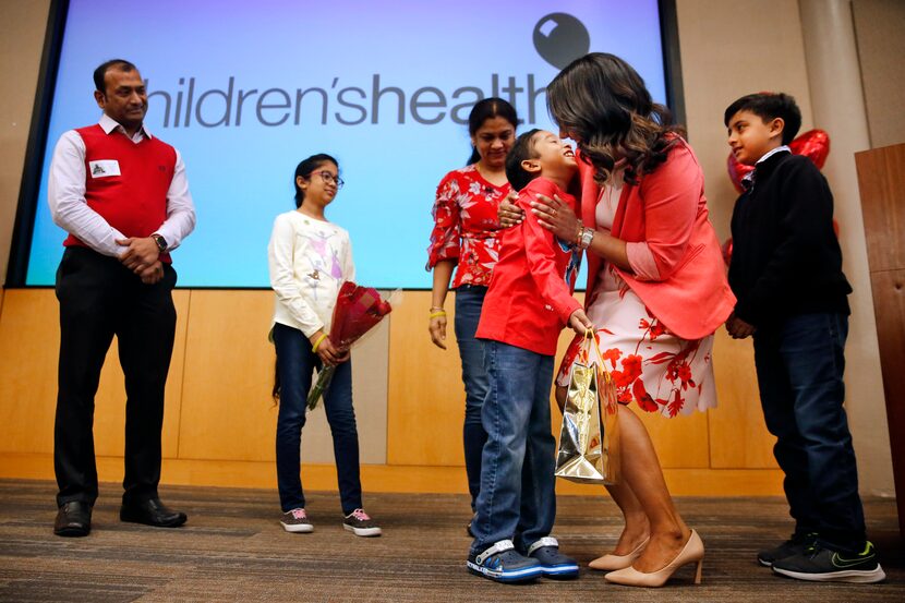 Bone marrow recipient Akshaj Nagilla gives his donor, Dr. Prasanthi Ganesa (second from...