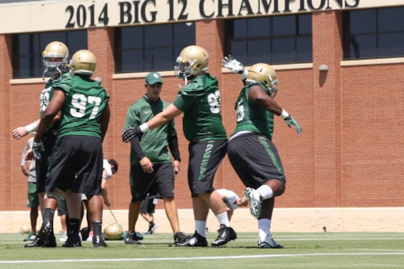 Baylor defensive players work out during the first day of practice for the 2015 season,...