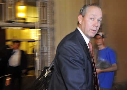FILE - Jim Crane does not stop to talk to the media as he exited from the Federal Courthouse...