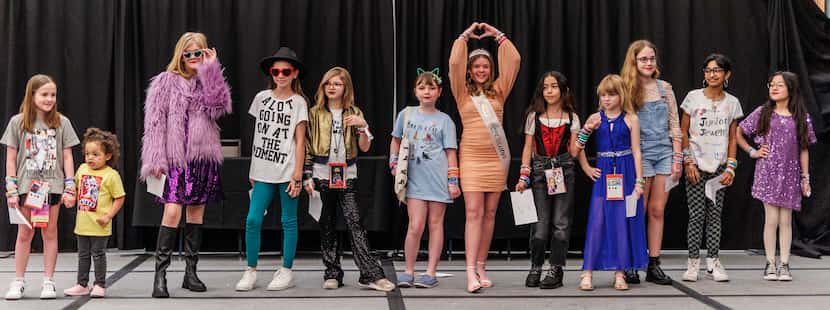 Contestants in the Taylor fashion contest strike a pose during the Swiftie-themed...