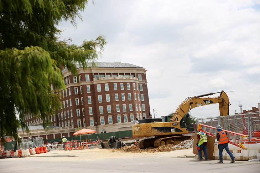 View of the Crow Holdings office building under construction at Maple Avenue and...