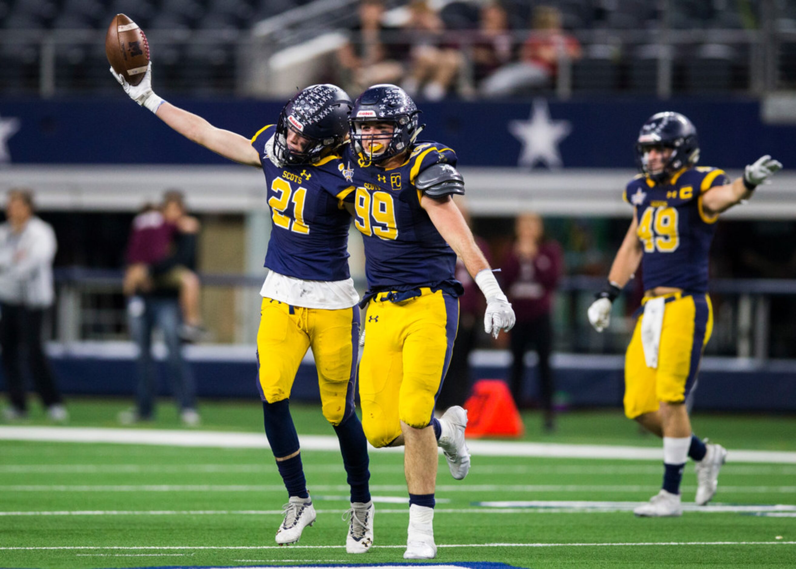 Highland Park defensive back Cole Filley (21) celebrates the recovery of a fumble with...