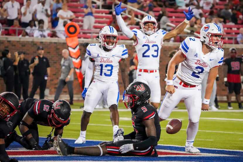 SMU quarterback Preston Stone (2) celebrates after scoring on an 8-yard touchdown run past...