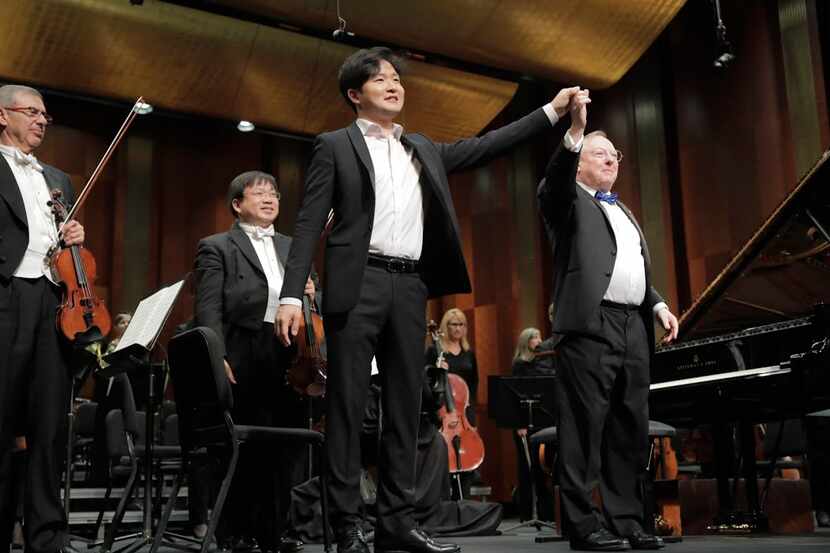 Gold medalist Yekwon Sunwoo from South Korea performs with conductor Nicholas McGegan and...