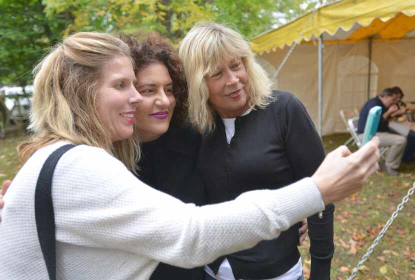 Sarah and Rhonda Walthers pose with "Big Stone Gap" author Adriana Trigiani, center, during...