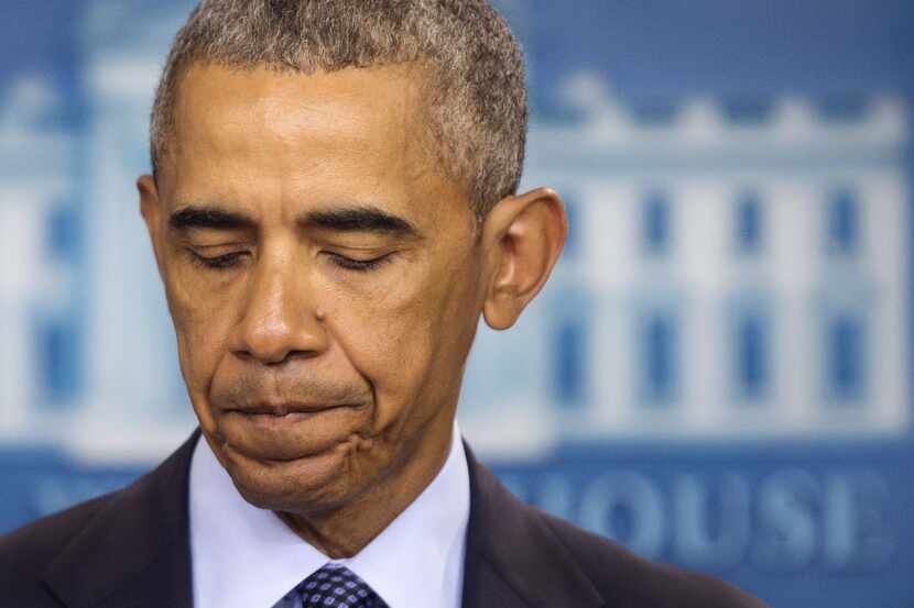 
American Legion members listen to President Barack Obama, who called the VA’s long wait...