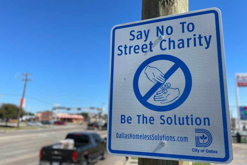 The city of Dallas is putting up signs that discourage residents from giving to panhandlers....