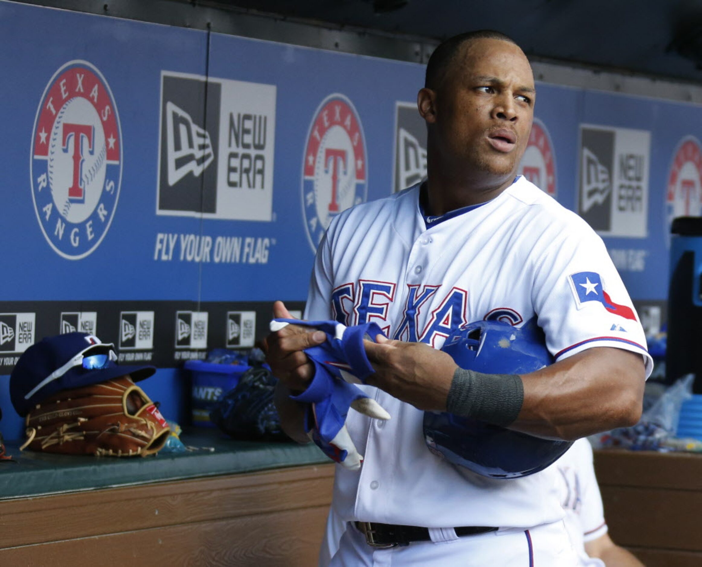 Texas third baseman Adrian Beltre is pictured in the dugout after being pulled for a pinch...