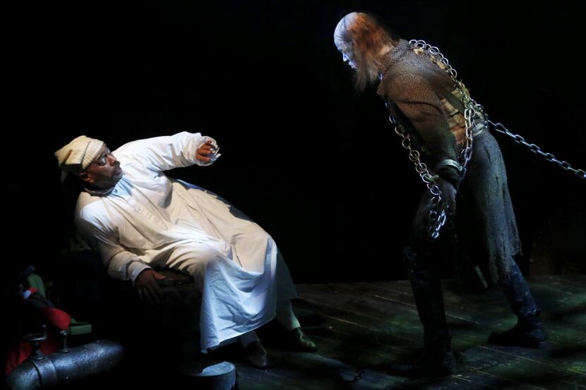  From left, Ebenezer Scrooge played by Hassan El-Amin reacts to Jacob Marley played by Alex...