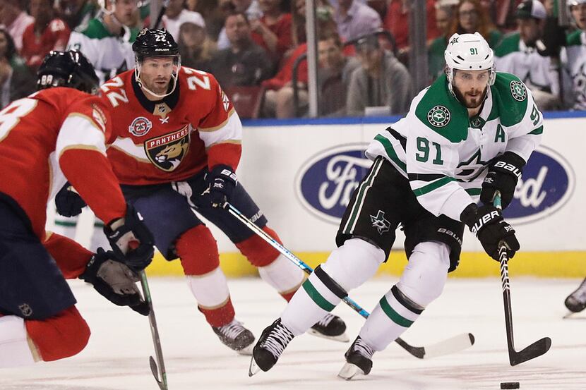 Dallas Stars center Tyler Seguin (91) and Florida Panthers right wing Troy Brouwer (22)...