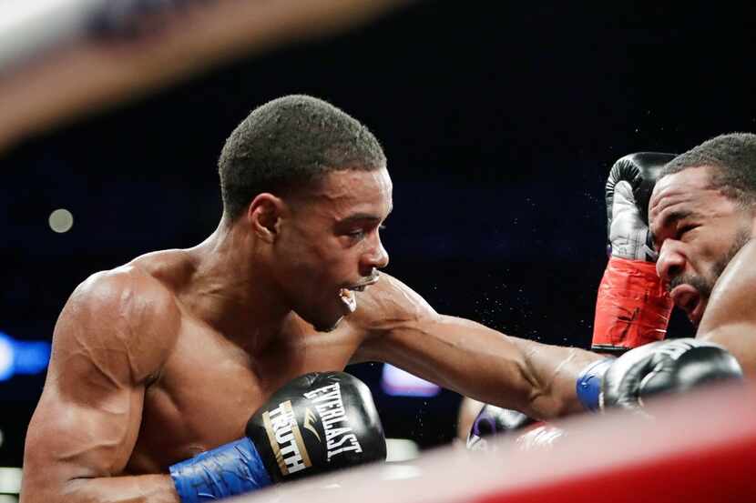 Errol Spence Jr., left, fights Lamont Peterson during the third round of an IBF welterweight...