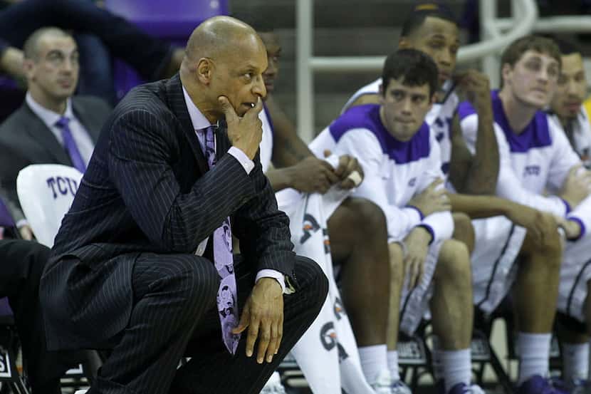 TCU Horned Frogs head coach Trent Johnson sports purple sneakers to commemorate Coaches...