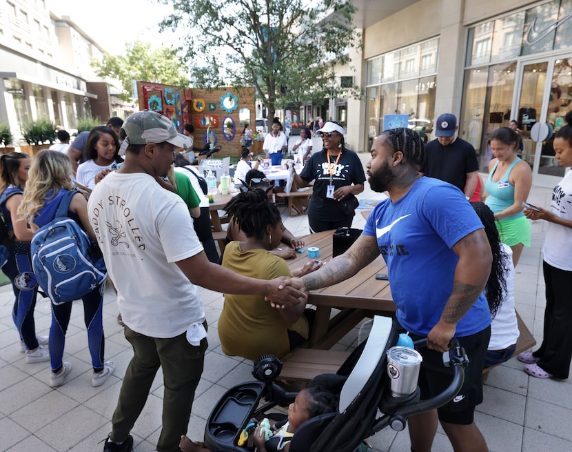 Community members meet during a Daddy Stroller Social Club event at Legacy West in Plano on...