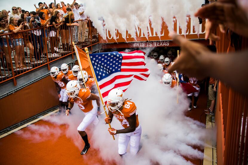 Texas Longhorns players enter the stadium before a college football game between TCU and the...