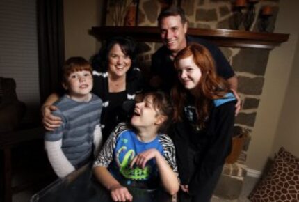  Clockwise from foreground center, a family portrait of the Samuels family taken in January...