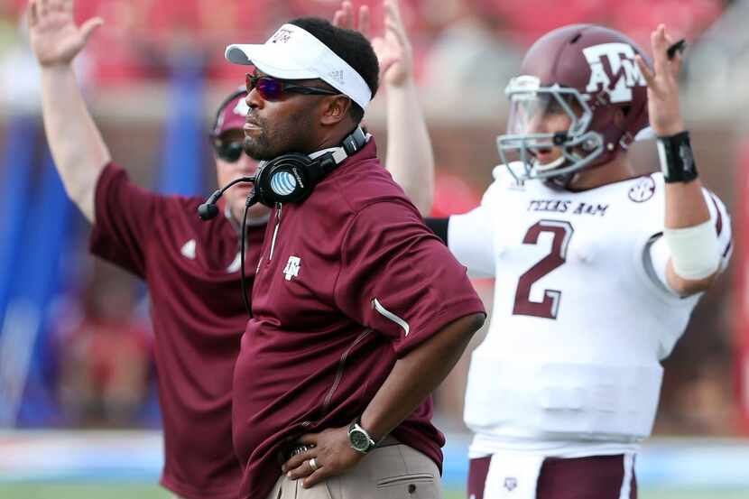Texas A&M coach Kevin Sumlin waits to see the ruling on a play, ruled a touchdown, in the...