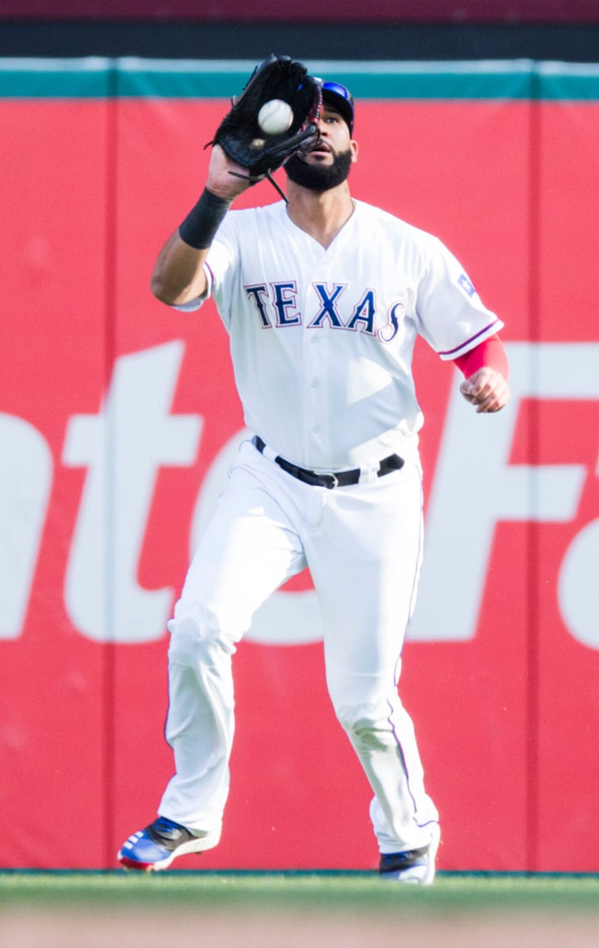 Texas Rangers right fielder Nomar Mazara (30) catches a fly ball during the ninth inning of...