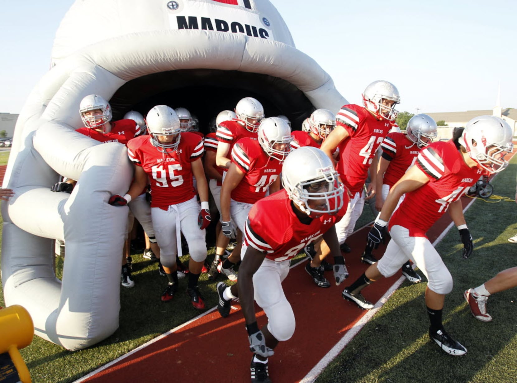 Pumped up: HS football teams spend $1,000s on inflatable spirit tunnels