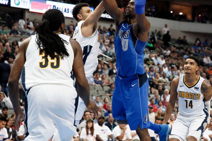 Harrison Barnes has improved his rebounding and continues to score at a nice clip, too.  (AP...
