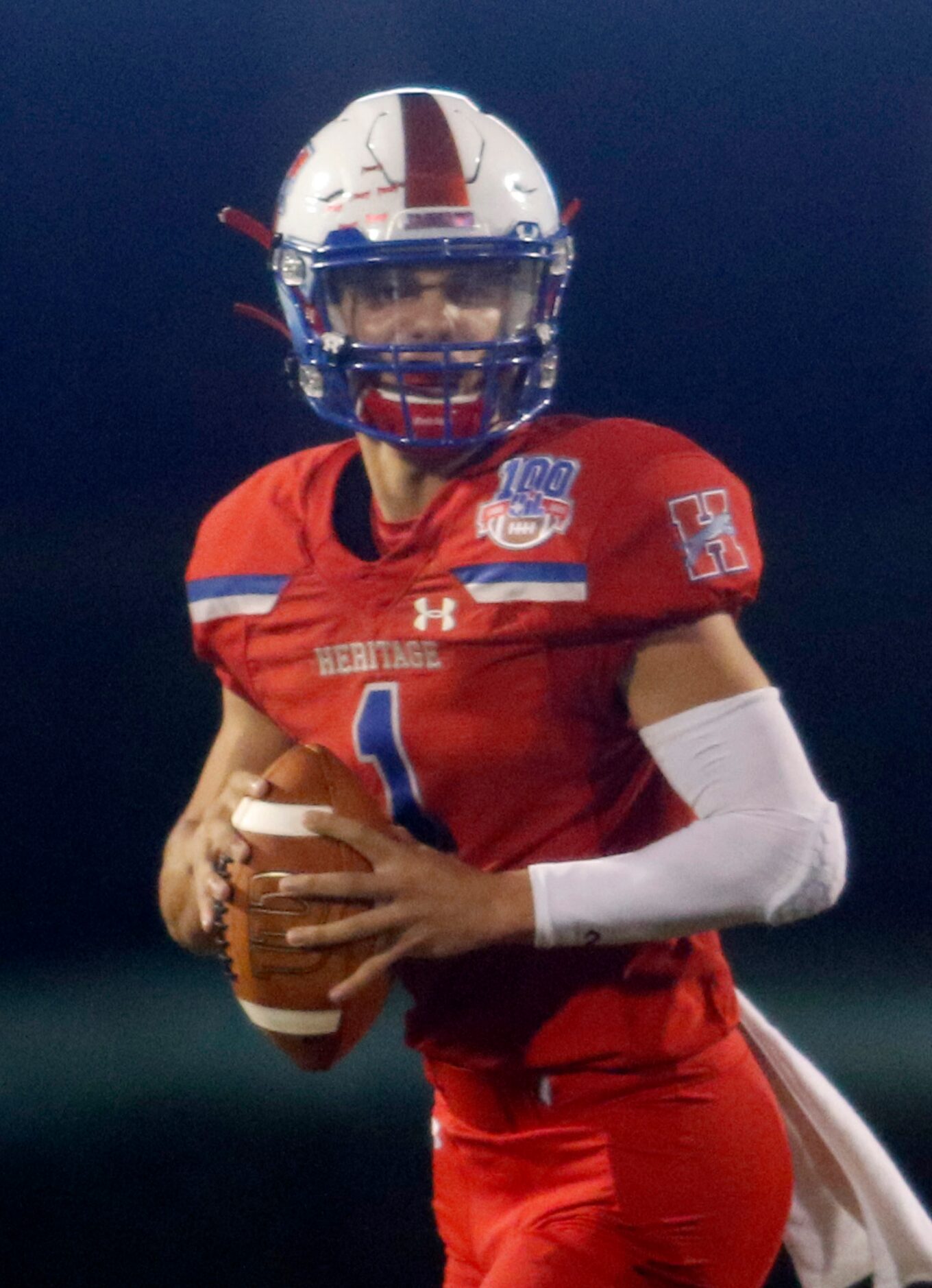 Midlothian Heritage quarterback Daelin Rader (1) looks for a receiver during second quarter...