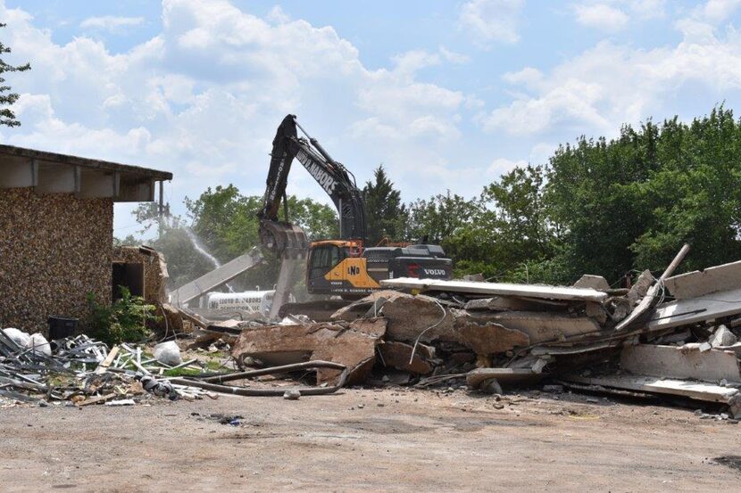 The Han Gil Hotel Town building will be torn down in phases because of asbestos issues.